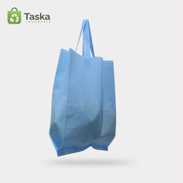 Tas Press Spunbond Handle – Biru Muda 38×45 Cm – Sisi kanan