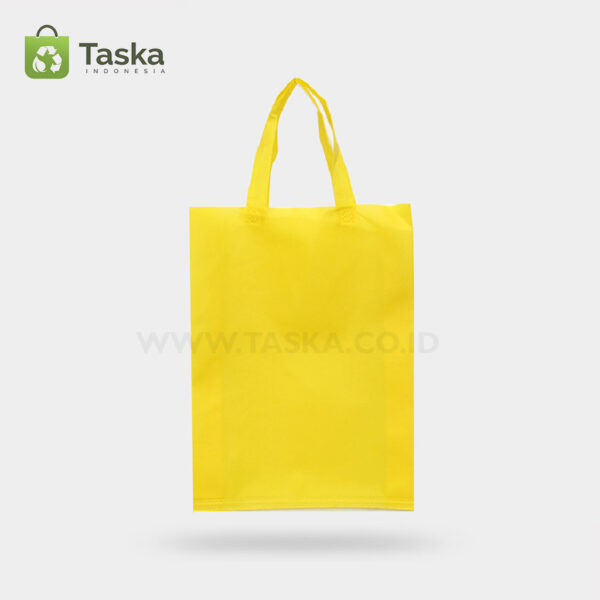 Tas Press Spunbond Handle – Kuning 30×40 Cm – Sisi Depan