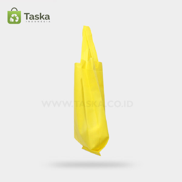 Tas Press Spunbond Handle – Kuning 30×40 Cm – Sisi Kanan