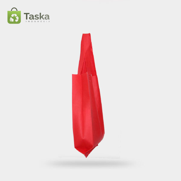 Tas Press Spunbond Handle – Merah 25×35 Cm – Sisi Kiri